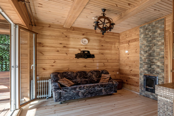 Awesome 50s era GMC Chevrolet Chevy pickup truck 3100 wall art shown on interior wooden wall in beautiful summer house above living room furniture